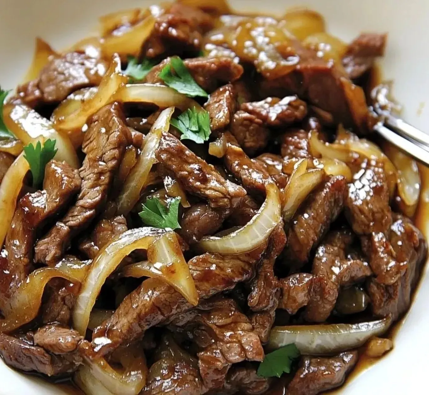 Bœuf sauté aux oignons